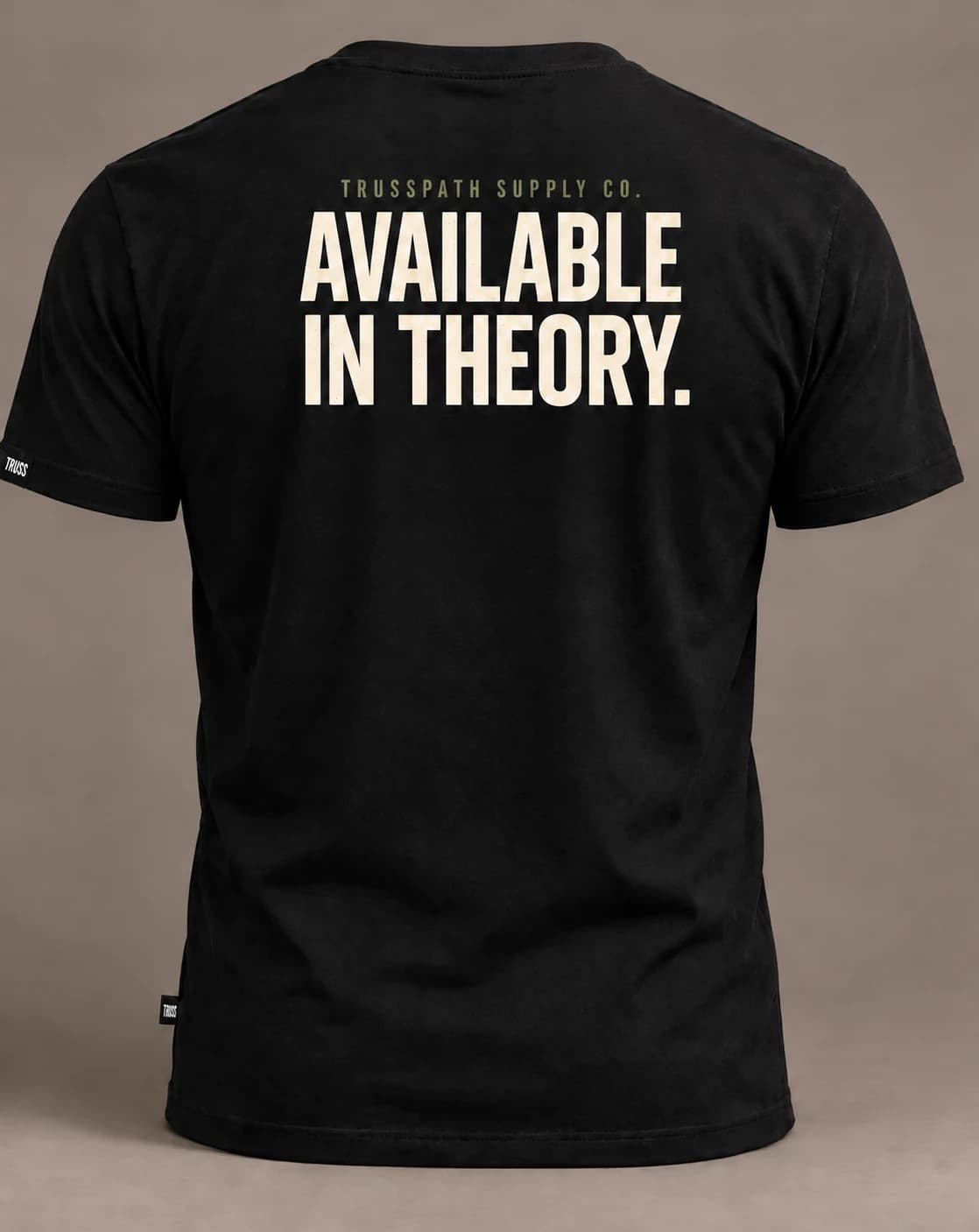 Available in Theory — back view on a black graphic tee, garment mockup
