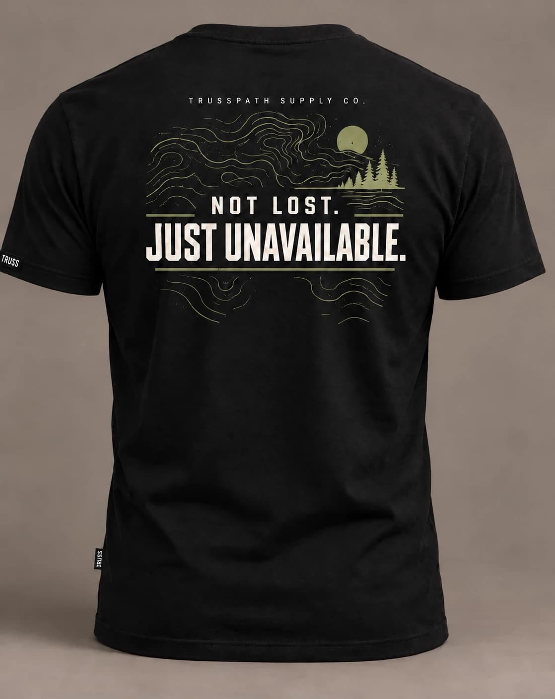 Just Unavailable — back view on a black graphic tee, garment mockup