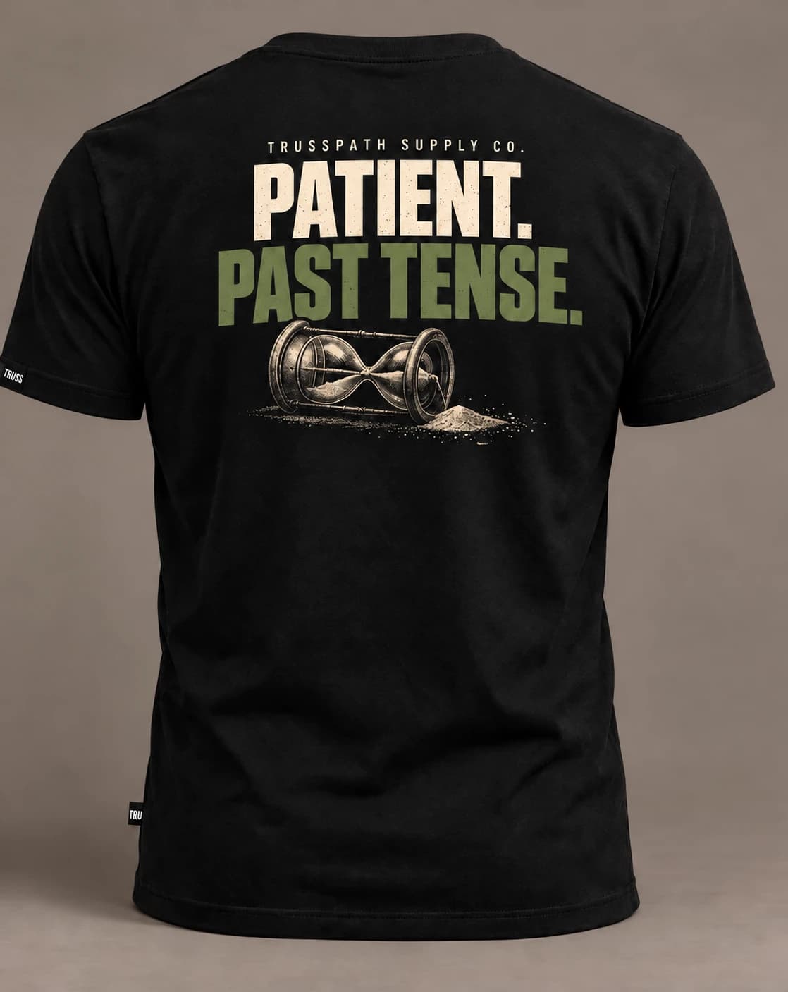 Patient. Past Tense. — back view on a black graphic tee, garment mockup